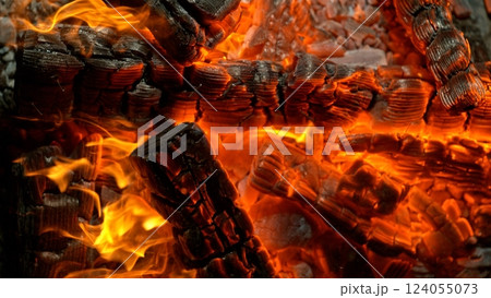 Close-up of Hot Embers with Flying Sparks . Concept of heating grills or ovens 124055073