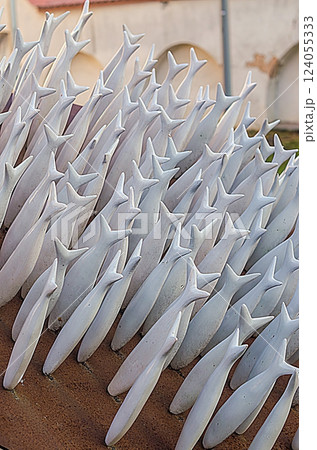 Abstract fish sculpture with dynamic movement, modern outdoor art installation. High quality photo 124055333