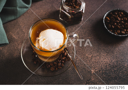 Affogato espresso coffee with vanilla ice cream in a cup on the table Affogato espresso coffee with vanilla ice cream in a cup on the table 124055795