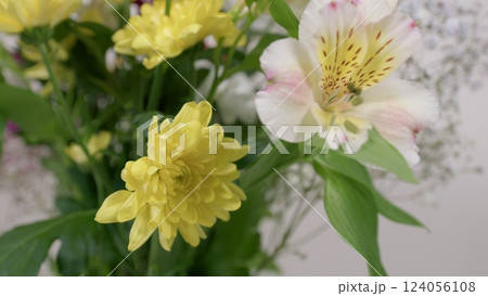 A floral arrangement with Alstroemeria and vibrant yellow flowers, ideal for any occasion A floral arrangement with Alstroemeria and vibrant yellow flowers, ideal for any occasion 124056108