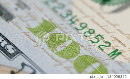 This is a macro shot that vividly showcases the intricate features of a hundred dollar bill 124056233