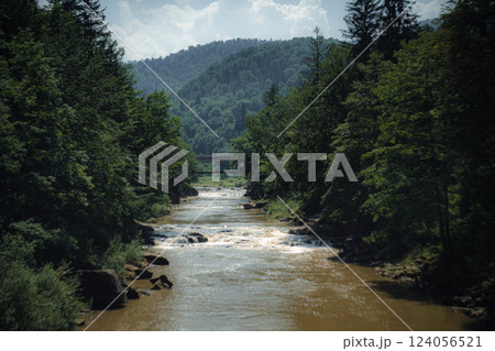 Mountain Stream with Rocky Rapids Flowing Down Mountain Stream with Rocky Rapids Flowing Down 124056521