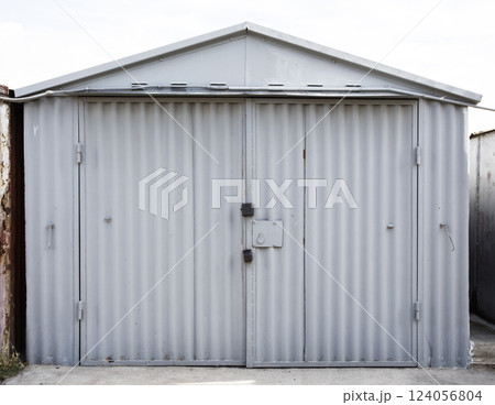old metal warehouse door, hangar 124056804