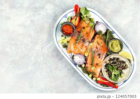 Two uncooked, raw salmon fillets. 124057003
