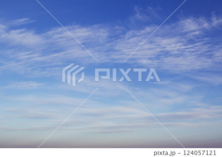 Blue sky with beautiful white clouds. Sky with cumulus and cirrocumulus clouds. Panoramic image of the sky. 124057121