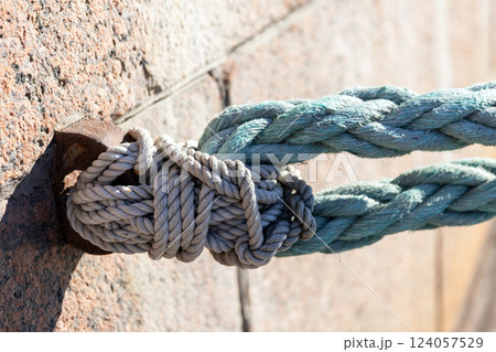 Detailed close-up photo of a securely tied nautical rope knot a 124057529