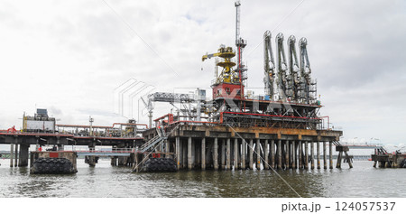 A detailed view of an offshore oil platform, showcasing its industrial details A detailed view of an offshore oil platform, showcasing its industrial details 124057537