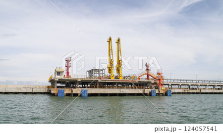 An industrial oil jetty platform with machinery and equipment An industrial oil jetty platform with machinery and equipment 124057541