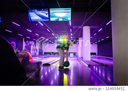Young boy child having fun and playing bowling 124058452