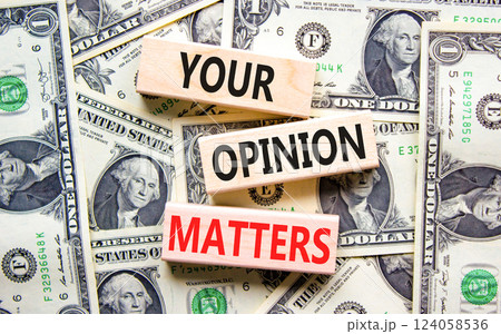 Your opinion matters symbol. Concept words Your opinion matters on beautiful wooden blocks. Dollar bills. Beautiful background from dollar bills. Business your opinion matters concept. Copy space. 124058536