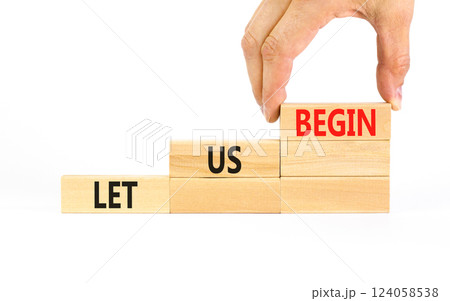 Let us begin symbol. Concept words Let us begin on beautiful wooden blocks. Beautiful white table white background. Businessman hand. Business motivational let us begin concept. Copy space. Let us begin symbol. Concept words Let us begin on beautiful wooden blocks. Beautiful white table white background. Businessman hand. Business motivational let us begin concept. Copy space. 124058538