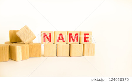 Name symbol. Concept word Name on beautiful wooden blocks. Beautiful white table white background. Business, lifestyle, support and name concept. Copy space. Name symbol. Concept word Name on beautiful wooden blocks. Beautiful white table white background. Business, lifestyle, support and name concept. Copy space. 124058570