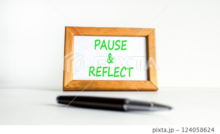 Pause and reflect symbol. Concept words Pause and reflect on beautiful wooden picture frame. Beautiful white background. Business motivational lifestyle pause and reflect concept. Copy space. 124058624
