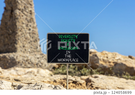 Diversity equity inclusion symbol. Concept words Diversity Equity and Inclusion in the workplace on blackboard on a beautiful stone background. Diversity equity inclusion workplace concept. Copy space 124058699