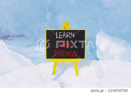 Learn new things symbol. Concept words Learn new things on beautiful black yellow blackboard. Beautiful blue Baikal ice background. Business motivational learn new things concept. Copy space. Learn new things symbol. Concept words Learn new things on beautiful black yellow blackboard. Beautiful blue Baikal ice background. Business motivational learn new things concept. Copy space. 124058700