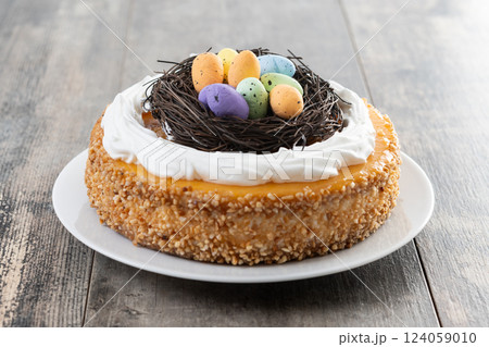 Homemade Easter egg cake on wooden table Homemade Easter egg cake on wooden table 124059010