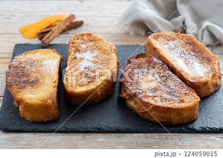 Traditional Spanish torrijas for Holy Week on wooden tableq Traditional Spanish torrijas for Holy Week on wooden tableq 124059015