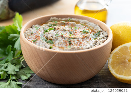 Traditional baba ganoush in bowl on wooden table 124059021