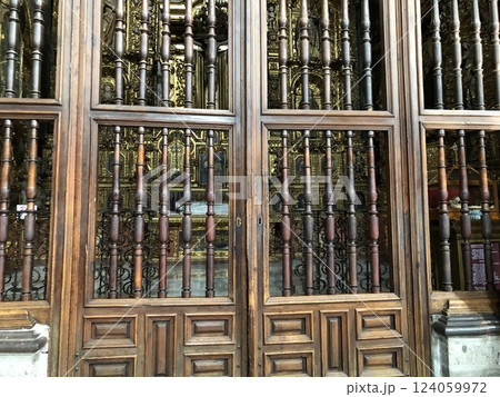 Mexico City, Mexico - 11.13.2019: Holy icons behind wooden doors in Cathedral of the Dormition of the Blessed Virgin Mary 124059972