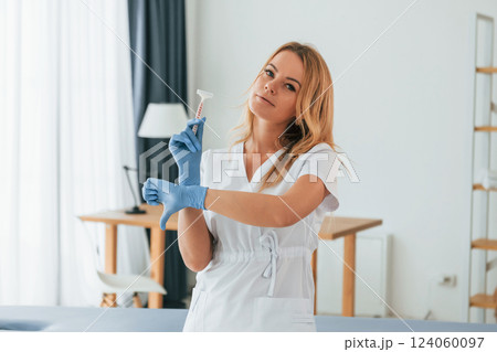 No more razor. Sugaring concept. Female doctor in white coat is standing in the clinic 124060097