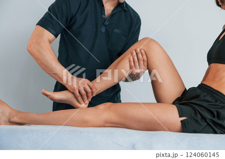 Laying down on the table. Woman visiting physiologist that making massages and helping with traumas Laying down on the table. Woman visiting physiologist that making massages and helping with traumas 124060145