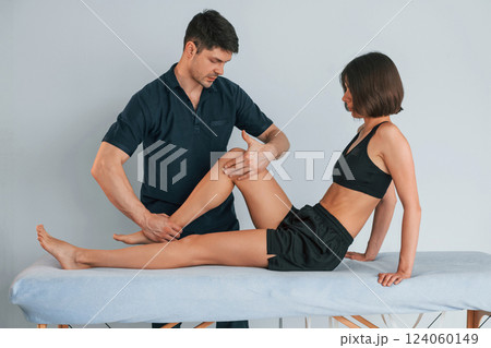 Laying down on the table. Woman visiting physiologist that making massages and helping with traumas 124060149