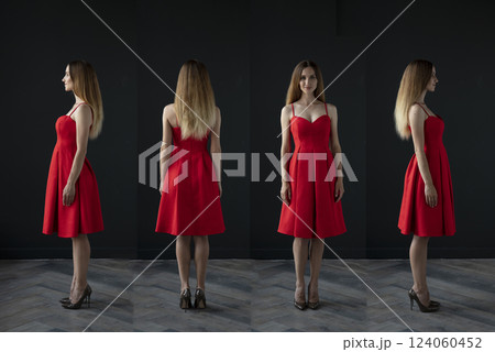 portrait of a beautiful young woman in a red dress, studio shot on a dark background 124060452