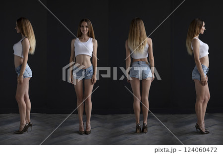 young girl in a t-shirt and shorts on a dark background, full length studio shot 124060472