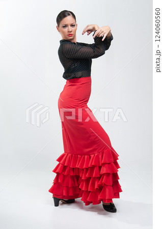 Spanish flamenco dancer in traditional dress isolated on white background for the April Fair Spanish flamenco dancer in traditional dress isolated on white background for the April Fair 124060560