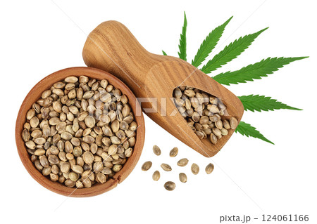Hemp seeds in wooden bowl isolated on white background with full depth of field. Top view. Flat lay Hemp seeds in wooden bowl isolated on white background with full depth of field. Top view. Flat lay 124061166