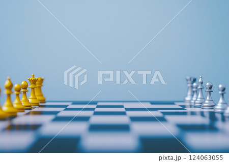 Gold and Silver Chess Pieces on a White Background with Checkered Board Pattern 124063055
