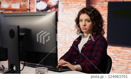 AI startup company developer testing company software to minimize occurrence of bugs, identifying bottlenecks. Woman in office writing code in programming language to reduce errors 124063701