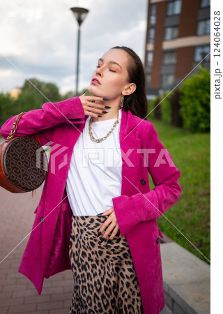Portrait of Confident Woman in Urban Fashion. Bold Colors and Stylish Outfit 124064028