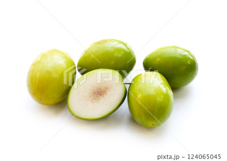 Green jujube fruits on white background. Green jujube fruits on white background. 124065045