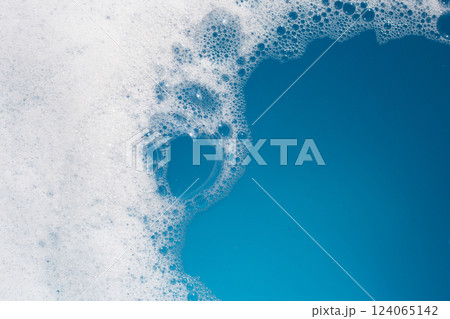 Detergent foam bubble on water. Blue background, Soap sud 124065142