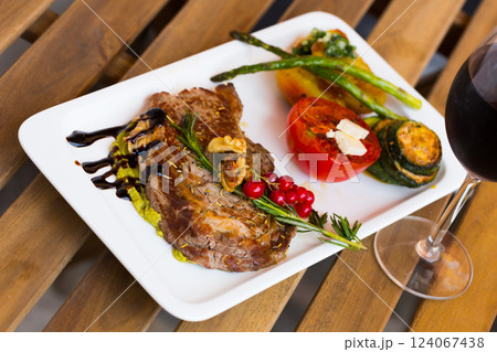 Photography of plate with baked veal with vegetables 124067438