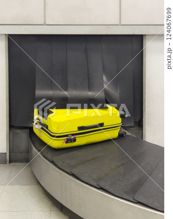 Suitcase on Baggage Claim Conveyor Belt 124067699