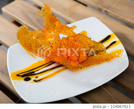 Dessert of pumpkin in caramel lace Dessert of pumpkin in caramel lace 124067821