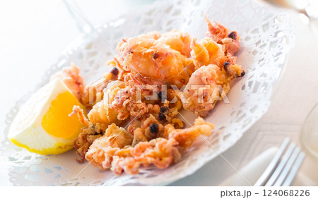 Chipirones, battered fried baby squid 124068226