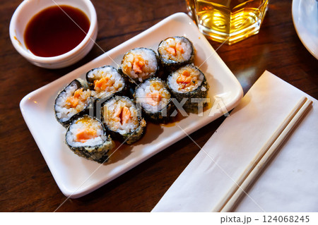 Fried maki rolls with salmon served soy sauce, japanese cuisine Fried maki rolls with salmon served soy sauce, japanese cuisine 124068245