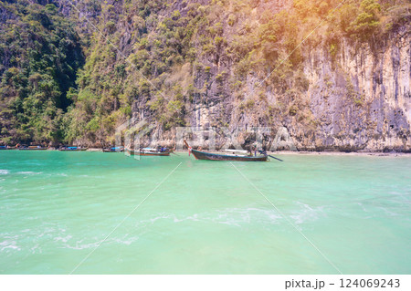 Long tail boat and speedboat at Pileh lagoon on Phi Phi island, Krabi, Thailand. landmark, destination Southeast Asia Travel, vacation and holiday concept Long tail boat and speedboat at Pileh lagoon on Phi Phi island, Krabi, Thailand. landmark, destination Southeast Asia Travel, vacation and holiday concept 124069243