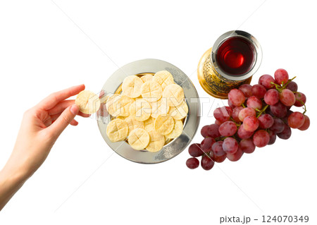 PNG, Eucharist, host in hand with chalice of wine and grapes, isolated on white background 124070349