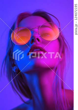 UV portrait of woman in neon lighting with round sunglasses UV portrait of woman in neon lighting with round sunglasses 124072195