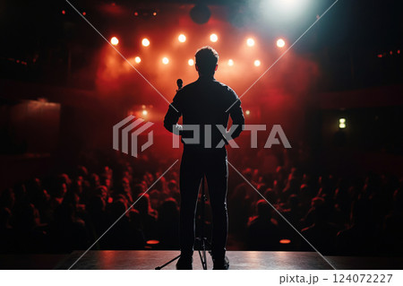 Comedian Performing Stand-Up on Stage with Spotlight 124072227