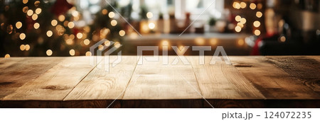 Empty wooden table top in kitchen with Christmas lights and decorations 124072235