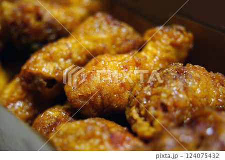 Korean style fried chicken with sweet soy sauce on the fried chicken 124075432