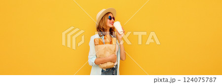 Happy bakery buyer young woman holding grocery shopping paper bag with bread baguette drinks coffee Happy bakery buyer young woman holding grocery shopping paper bag with bread baguette drinks coffee 124075787