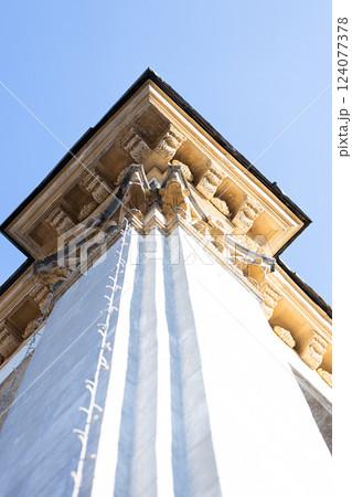 A Stunning Architectural Detail Captured in Perspective Featuring Ornate Cornices Under a Clear Blue Sky A Stunning Architectural Detail Captured in Perspective Featuring Ornate Cornices Under a Clear Blue Sky 124077378