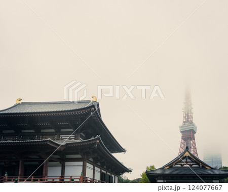 Rainy day at Zojo-ji temple with water dripping from its wooden eaves while mist-covered Tokyo Tower Rainy day at Zojo-ji temple with water dripping from its wooden eaves while mist-covered Tokyo Tower 124077667