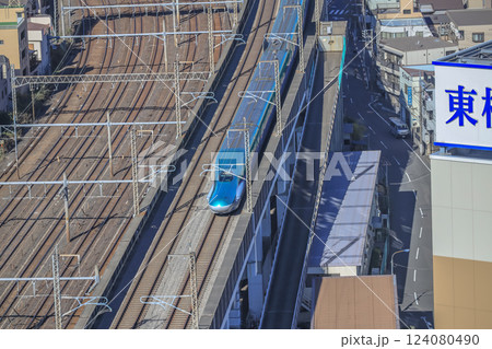 Train Passing Through an Urban Railway Station, Tokyo Dec 6 2024 124080490